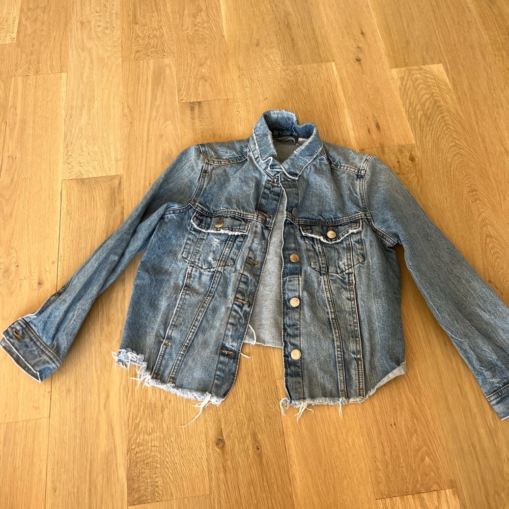 Denim jacket with worn look.